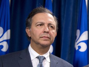 Quebec Treasury Board chairman Sam Hamad has decided to go to Florida the same week the National Assembly's commissioner of ethics is to examine his conduct in dealing with a firm connected to an ex-Liberal MNA who was arrested last month by the province's anti-corruption squad.