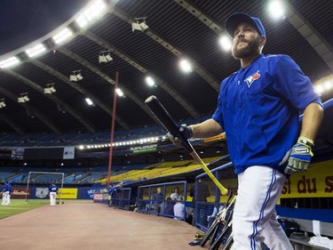 Toronto Blue Jays catcher Russell Martin takes to the field at Olympic Stadium for batting practice prior to facing the Cincinnati Reds in MLB exhibition action Friday, April 3, 2015, in Montreal.
