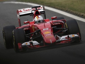 Ferrari driver Sebastian Vettel of Germany comes into the pit-lane after the second practice session for the Chinese Formula One Grand Prix at Shanghai International Circuit in Shanghai, China, Friday, April 10, 2015.