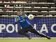 Montreal Impact goalkeeper Kristian Nicht kicks makes a save during a training session in Montreal, Tuesday, April 28, 2015, ahead of the Impact's CONCACAF Champions League final game against Mexico's Club América.