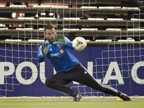 Montreal Impact goalkeeper Kristian Nicht kicks makes a save during a training session in Montreal, Tuesday, April 28, 2015, ahead of the Impact's CONCACAF Champions League final game against Mexico's Club América.