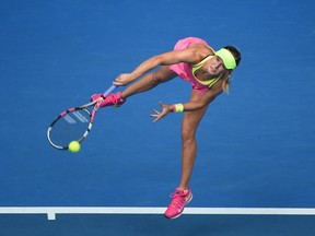 Westmount's Eugenie Bouchard serves during match against Russia's Maria Sharapova at the Australian Open on Jan. 27, 2015.