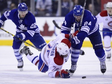 Toronto Maple Leafs' Peter Holland (24) knocks Montreal Canadiens' P.K. Subban (76) to the ice during second period NHL action in Toronto on Saturday, April 11, 2015.