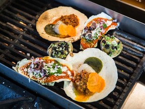 Chef Marc-André Leclerc's Nacho-Style BBQ shells, featuring sea angel oysters, clams and scallops topped with delicious Tex-Mex fixings, warm on the grill.