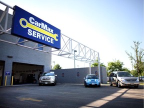 Cars sit in the parking lot of used car retailer CarMax in Naperville, Illinois.