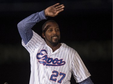 Former Montreal Expos Vladimir Guerrero waves to the crowd as he is presented during a pre-game ceremony as the Toronto Blue Jays face the Cincinnati Reds in  MLB exhibition play Friday, April 3, 2015, in Montreal.