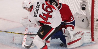 Ottawa Senators' Patrick Wiercioch slides puck past Montreal Canadiens goalie Carey Price, to tie game 2-2, during third period action in Montreal on Friday April 17, 2015. The Montreal Canadiens meet the Ottawa Senators in the first round of the NHL playoffs.
