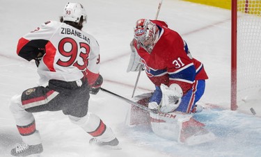 Montreal Canadiens goalie Carey Price, right, is scored on by Ottawa Senators right wing Bobby Ryan, not pictured, as Ottawa Senators center Mika Zibanejad, left, looks out for a rebound during the first period of game five of their NHL Eastern Conference quarter-final match at the Bell Centre in Montreal on Friday, April 24, 2015. (Dario Ayala / Montreal Gazette)