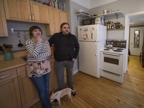 Staci Kufsky and Davis Adams in the kitchen of their small Montreal apartment on Friday, April 24, 2015.