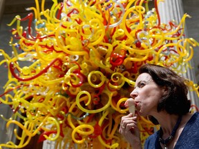 Alexandra MacDougall enjoys a sorbet at The Montreal Museum of Fine Arts in Montreal on Tuesday, May 12, 2015. The Museum set up chairs around Dale Chihuly's The Sun sculpture and offering people sorbet with flavours inspired by the sculpture.