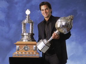 Canadiens goaltender José Theodore poses for a studio portrait with the Hart Memorial Trophy (in his hands), awarded to the NHL's most valuable player, and the Vézina Trophy, voted to the league's most outstanding goaltender, at the 2002 NHL awards.