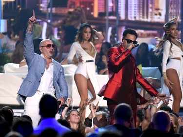 Recording artists Pitbull (L) and Chris Brown perform onstage during the 2015 Billboard Music Awards at MGM Grand Garden Arena on May 17, 2015 in Las Vegas, Nevada.