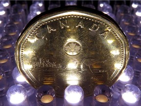 A loonie is pictured in North Vancouver, in April, 2014.