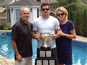 Alex Killorn (centre), who grew up in Beaconsfield and now plays for the Tampa Bay Lightning, poses with his parents Matt and Cindy after winning the Calder Cup American Hockey League championship with the Norfolk Admirals in 2012.