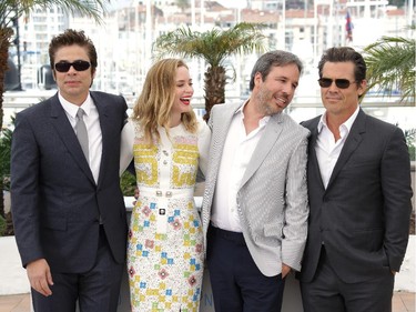 From left, Benicio del Toro, Emily Blunt, director Denis Villeneuve and Josh Brolin pose for photographers during a photo call for the film Sicario, at the 68th international film festival, Cannes, southern France, Tuesday, May 19, 2015.