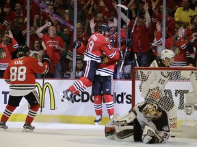 Chicago Blackhawks left wing Brandon Saad (20) celebrates his goal against the Anaheim Ducks with Chicago Blackhawks centre Jonathan Toews (19) during the second period in Game 6 of the Western Conference finals of the NHL hockey Stanley Cup Playoffs, Wednesday, May 27, 2015, in Chicago.