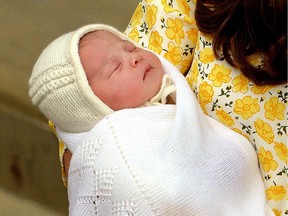 Britain's Catherine, Duchess of Cambridge holds her newly-born daughter, her second child with Britain's Prince William, Duke of Cambridge, as they show her to the media outside the Lindo Wing at St Mary's Hospital in central London, on May 2, 2015.  The Duchess of Cambridge was safely delivered of a daughter weighing 8lbs 3oz, Kensington Palace announced. The newly-born Princess of Cambridge is fourth in line to the British throne.