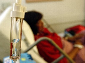 A breast cancer patient receives a chemotherapy drip.