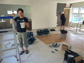 Lawyers and employees of Borden Ladner Gervais — including Christine Lamontagne, left, and Carl Blanchette — helped paint, sort donations, clean and put books in order at a centre associated with the Fondation du Dr Julien.