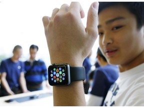 Acustomer tries on an Apple Watch in Hong Kong in April 2015.