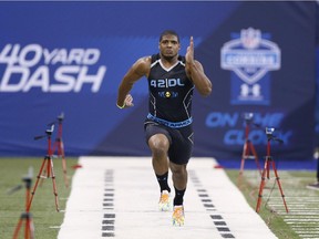 Defensive lineman Michael Sam runs the 40-yard dash during the 2014 NFL Combine at Lucas Oil Stadium on Feb. 24, 2014 in Indianapolis.