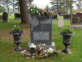 Aurore Gagnon's headstone in the graveyard right next to the  church in Fortierville.