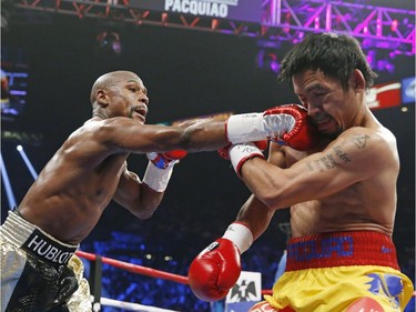 Floyd Mayweather Jr., left, connects with a right to the head of Manny Pacquiao, from the Philippines, during their welterweight title fight on Saturday, May 2, 2015 in Las Vegas.