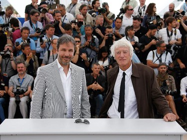 Canadian director Denis Villeneuve (L) and British director of photography Roger Deakins pose during a photocall for the film Sicario at the 68th Cannes Film Festival in Cannes, southeastern France, on May 19, 2015.