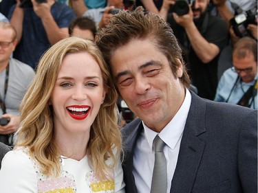 British actress Emily Blunt (L) and US-Puerto Rican actor Benicio Del Toro pose during a photocall for the film "Sicario" at the 68th Cannes Film Festival in Cannes, southeastern France, on May 19, 2015.