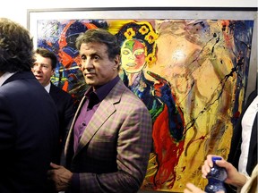 Sylvester Stallone with one of his paintings in an exhibition called Real Love, at the Museum of Contemporary Art in Nice.