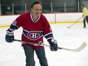 Coalition Avenir du Québec leader Francois Legault takes part in a friendly hockey game with supporters while campaigning in March 2015.