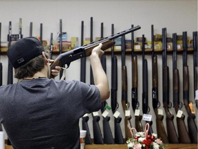 A customer checks out a shotgun at a store in Texas.