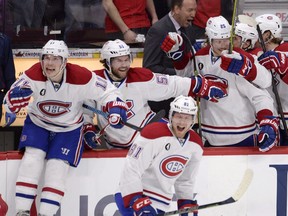 Montreal Canadiens players celebrate their victory over the Ottawa Senators in NHL playoff action in Ottawa on April 26, 2015.
