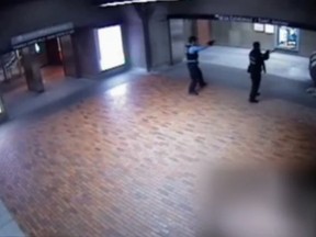 Montreal police officers are seen with guns drawn during an incident that ended in the death of Farshad Mohammadi at the Bonaventure métro station. The surveillance video was leaked to investigative news show J.E.