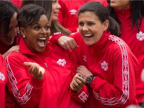Team Canada goalkeeper Karina LeBlanc, left, and captain Christine Sinclair joke around after the roster for the 2015 FIFA Women's World Cup was announced in Vancouver on April 27, 2015.