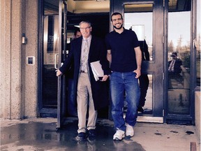 Omar Khadr (right) walks out of court on bail with his lawyer Dennis Edney (left), in Edmonton on Thursday, May 7, 2015 in a photo provided by his lawyer Nathan Whitling.