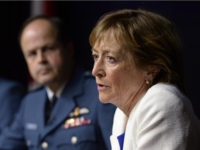 Marie Deschamps, a former Supreme Court justice and author of an inquiry into sexual misconduct in the Canadian Forces, speaks at a news conference in Ottawa on Thursday, April 30, 2015. General Tom Lawson, Chief of the Defence Staff, is at left.