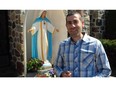 MAY 13, 2015, MONTREAL, Quebec - Patrick Daniel, a West Island accountant is a descendant of a Palestinian Christian nun who founded the Congregation of Rosary Sisters of Jerusalem (the Rosary Sisters) in 1880. On Sunday May 17, 2015, Blessed Mother Marie-Alphonsine Ghattas will be declared a saint. Patrick Daniel is travelling to Rome along with his mother Fadia Ghattas and brothers John Daniel and Michael Daniel for his great, great aunt's canonization. Patrick Daniel is pictured with his rosary in front of the Virgin Mary at St. Luke Parish in Dollard-des-Ormeaux, the Roman Catholic church where the family worships. PHOTO CHERYL CORNACCHIA/THEGAZETTE