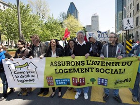 Members and supporters of social housing advocates FRAPRU demonstrate in the streets of Montreal Thursday, May 21, 2015.