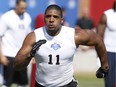 Defensive End Michael Sam, from Missouri, runs through a drill during the NFL Super Regional Combine football workout, Sunday, March 22, 2015, in Tempe, Ariz.
