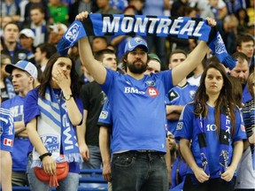 Impact fans show their disappointment after losing 4-2 to Mexico's Club America in the second leg of CONCACAF Champions League final at Montreal's Olympic Stadium on April 29, 2015.