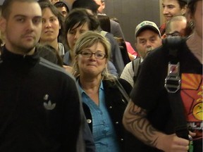 Hamza Babou's mother, centre, and supporters of the UQAM student protester exit the courtroom in Montreal, April 30, 2015.