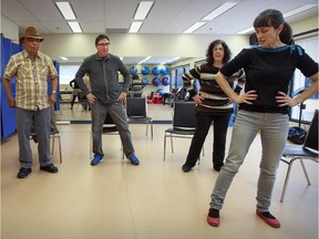 Dance instructor Katy Harris-McLeod, right, leads Syed Asmat Ali, Stuart Nagus and Gloria Sexsmith through some dance moves during the Broadway class designed for people with Parkinson's disease at the Cummings Centre in Montreal.