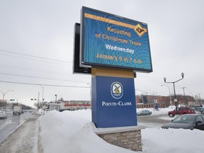 An electronic billboard stands next to the city hall in Pointe-Claire, which has bilingual status under Quebec's language charter.