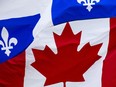 Canada and Quebec flags outside the Montreal Midtown Holiday Inn hotel in downtown Montreal on Friday, July 13, 2012.