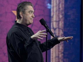 Canadian comic Mike MacDonald performs at a gala hosted by Jim Gaffigan at Salle Wilfred Pelletier as part of Just For Laughs festival, in Montreal, Sunday July 27, 2014. MacDonald died from heart complications at the Ottawa Heart Institute on Saturday.