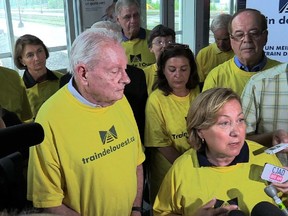 This is not the Train de l'Ouest coalition's latest plea. A delegation of about 15 people, including Train de l'Ouest spokesman Clifford Lincoln (left), a former Quebec minister and MP,  Baie-d'Urfé Mayor Maria Tutino (right, speaking).