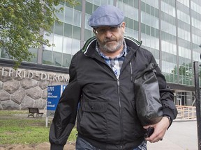 Former city councillor Saulie Zajdel, from Côte des Neiges-Notre Dame de Grâce borough, leaves Sûreté du Québec headquarters after being arrested by UPAC June 17, 2013.