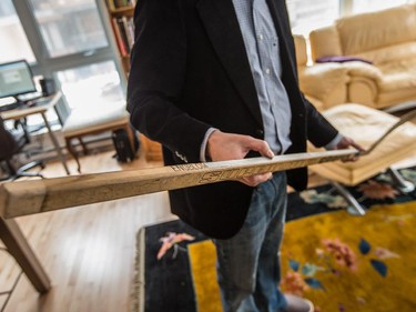 John Watson shows the hockey stick of former Canadiens hockey player Brian Engblom from the 1978-79 season at his condo in St-Henri.