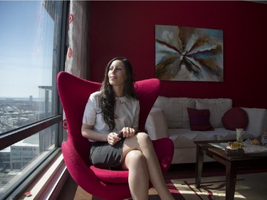 Imen Demni, a senior business analyst for Bell, sits by the window of her Nun's Island condo, Wednesday March 25, 2015.